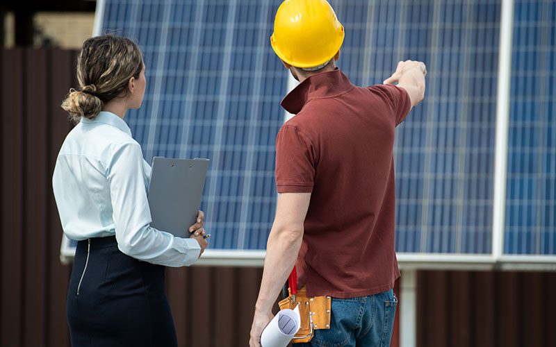 contractor-showing-installed-solar-panels-2021-09-24-03-45-07-utc contractor-showing-installed-solar-panels-2021-09-24-03-45-07-utc